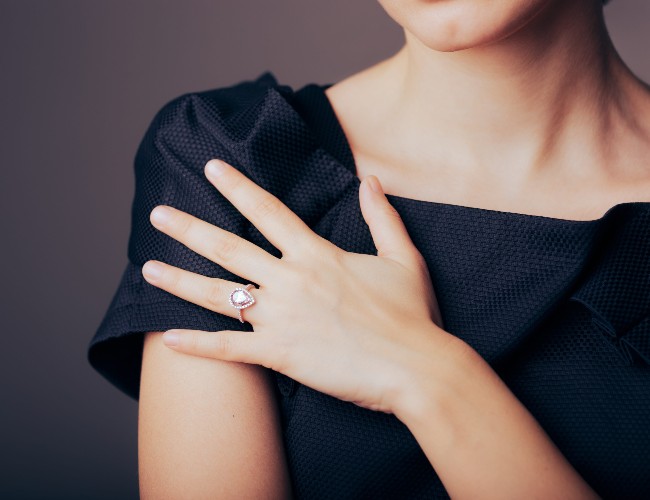 woman with engagement ring on hand